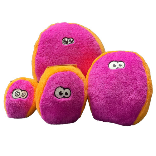 Colorful pink and orange fuzzy plush balls with cartoon eyes grouped together.