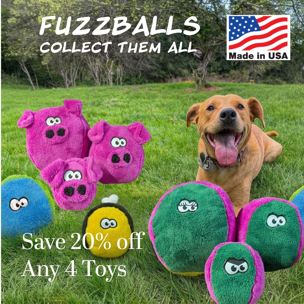 Untitled - July 13 2026 at 113359-3 - Cycle Dog-Earth Friendly Pet Company Happy brown dog on a grassy field surrounded by colorful fuzzy plush balls; promotional text reads 'FUZZBALLS Collect Them All' and 'Save 20% off Any 4 Toys' with a Made in USA badge.